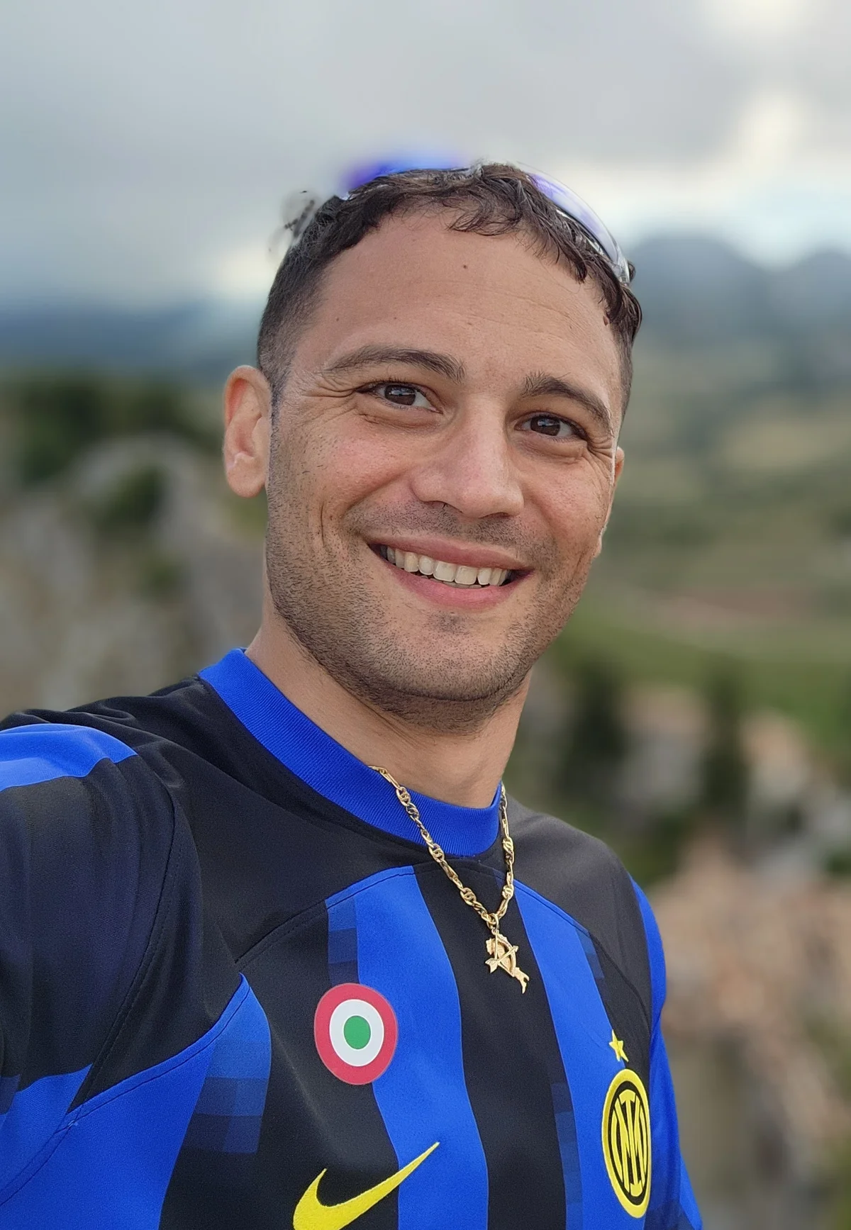Profile Photo of Franco N. Colaizzi with a blurred background of Abruzzo, Italy from 2025